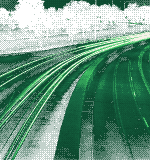 Light trails from traffic on a curving highway at night, rendered as a green dither